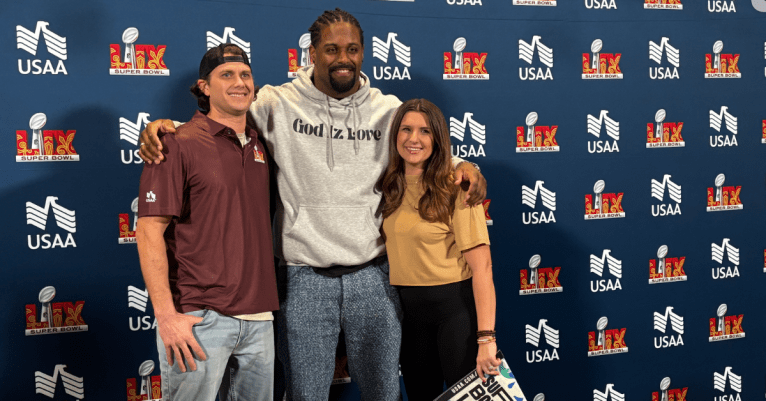 Cam Jordan poses with super bowl ticket recipients