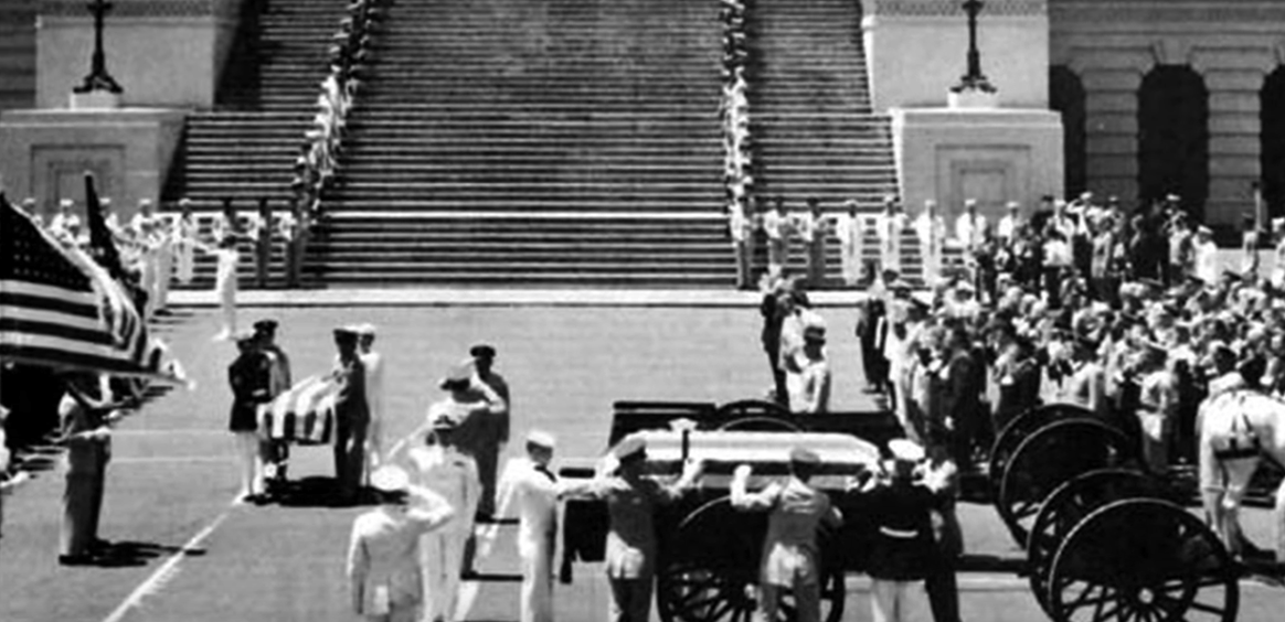 An unknown casket being carried to the honorary tomb, its final resting place
